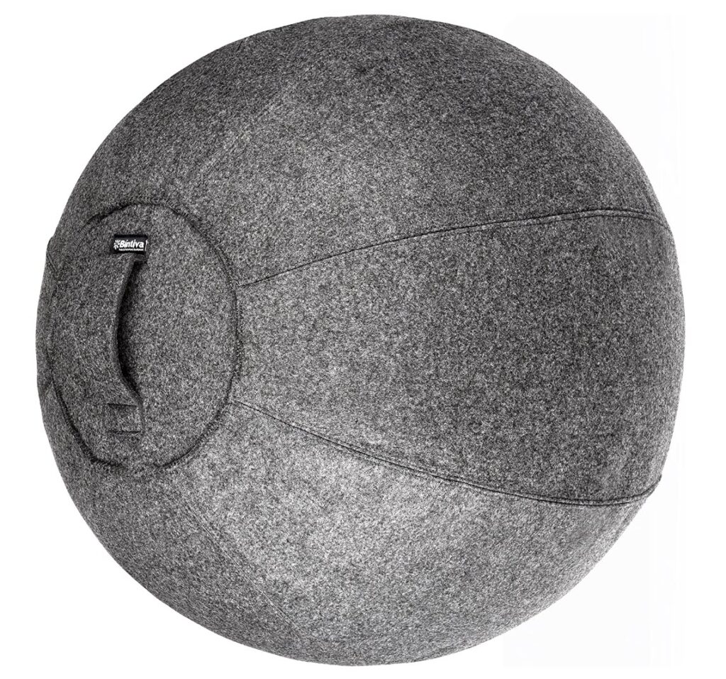 Photo of a yoga ball that is covered in grey felt material. 